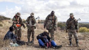Opportunity knocks: South African soldiers (above) check documents while patrolling the porous South Africa-Zimbabwe border near Musina. The town, near the Beitbridge border post, was home to a brisk trade. / Photo Credit: Oupa Nkosi, Mail & Guardian