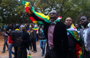Supporters of the #ThisFlag campaign demonstrate outside the Harare Magistrates Court on July 13. (Jekesai Njikizana/AFP Photo/Getty Images)