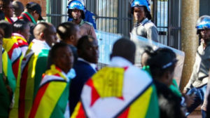 Public and police face off outside Harare Magistrate's Court / Photo credit: Irish Times
