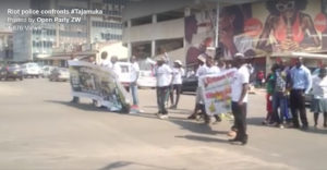 Riot police confronts Tajamuka/Sesjikile Campaign protesters at the intersection of Sam Nujoma and Nelson Mandela near parliament buildings.